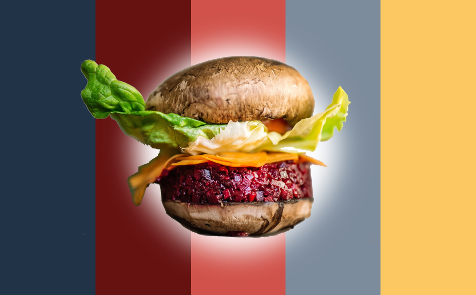 Burger végétarien avec champignons en guise de pain, steak de betterave, fromage et laitue sur fond coloré rayé.